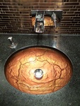 Maple Ridge Residence's beautiful orange sink design by Interior design firm in Port Coquitlam