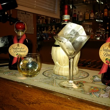 Wine Glass containing Ice cube on Bar Counter