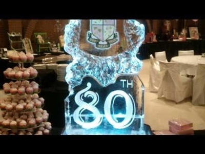A tall beautiful anniversary ice sculpture with logo