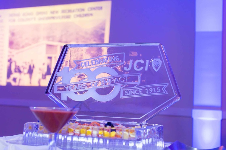 Corporate Event sign with ice sculpture promoting 100 years of the company organized by Houston Event Planning