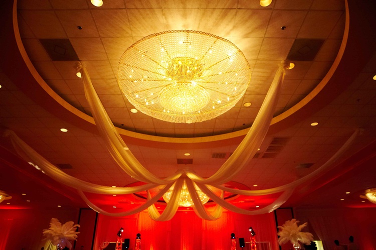 Red and gold sparkling lights and decorations for a 60th birthday party organized by Houston Event Planning