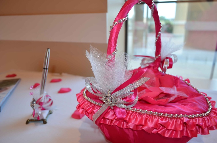 Quinceañera-themed props and decorations and pen for guests to sign organized by Houston Event Planning