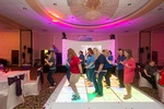 Corporate Event team building activity with participants dancing together organized by Houston Event Planning