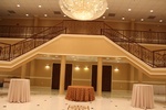 Indoor party scene with string lights, seating and a bar setup organized by Houston Event Planning
