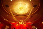 Red and gold sparkling lights and decorations for a 60th birthday party organized by Houston Event Planning