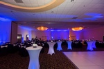 Beautiful table set up under the disco ball with elegant lighting by Houston Event Planning