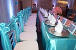 Table setting with ornate place cards and personalized party favors for a Quinceañera done by Houston Event Planning