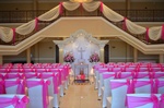 Quinceañera court walking down a grand staircase and an altar done by Houston Event Planning