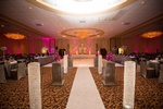 Reception venue with decorative lighting and floral arrangements done by Houston Event Planning