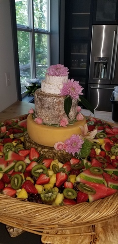 A Cake surrounded with Salad by Christie's Catering - Event Catering Services Tacoma