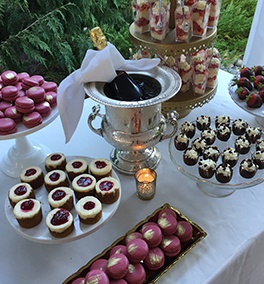 A bottle of wine among a variety of sweets at an Event Catering by Christie's Catering in Tacoma