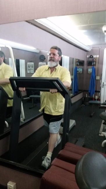 A Man on a Treadmill - Cardio and Aerobic Equipments in Mobile Gym  Hollywood