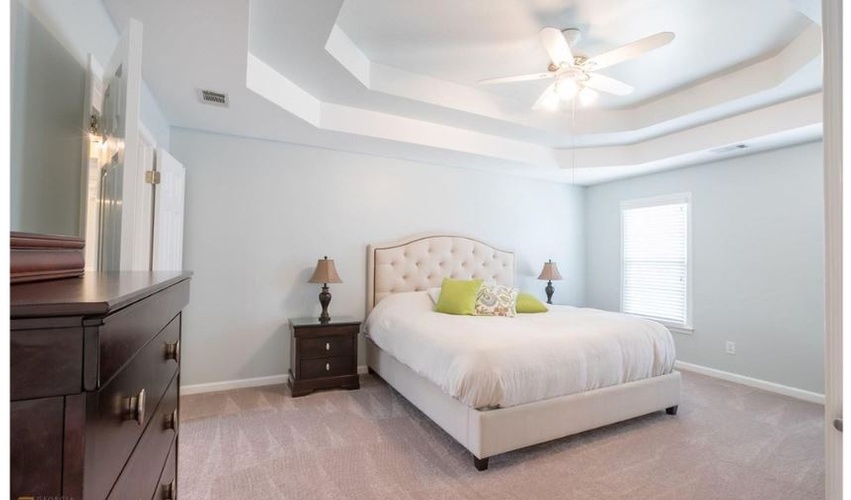 Bedroom with Comfortable Flooring and  Rich Furniture - Home Staging Wilson by Sage Key Interiors