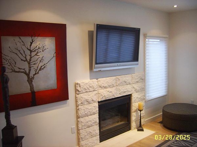 Wall Mounted Flat Screen TV above Fireplace by Frederick CEDIA Certified Technician - Nerical LLC