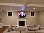 Flat Screen TV Wall Mounted above Fireplace by CEDIA Certified Technician in Frederick