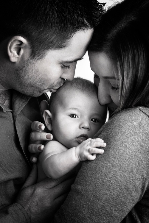 Parents Kissing Newborn Baby - Family Photography Shelburne by Matt Tibbo