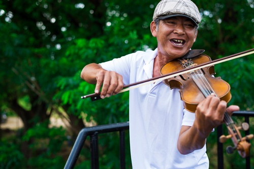 Aged man playing a Violin - Travel Photography Services Burlington by Matt Tibbo