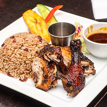 Sweet and tangy Caribbean-style BBQ ribs, perfect for summertime grilling at Scotthill Caribbean Cuisine