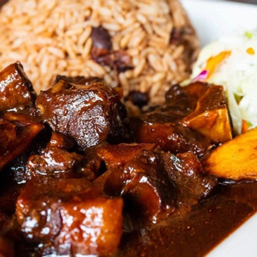 Bold and flavorful Caribbean curries bursting with aromatic spices at Scotthill Caribbean Cuisine