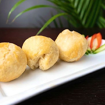 Authentic Jamaican-style fried dumplings, a delicious and filling side dish at Scotthill Caribbean Cuisine