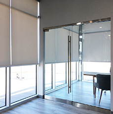 Luxury White Window Roller Shade for an office area installed by Winco Blinds & Window Fashion