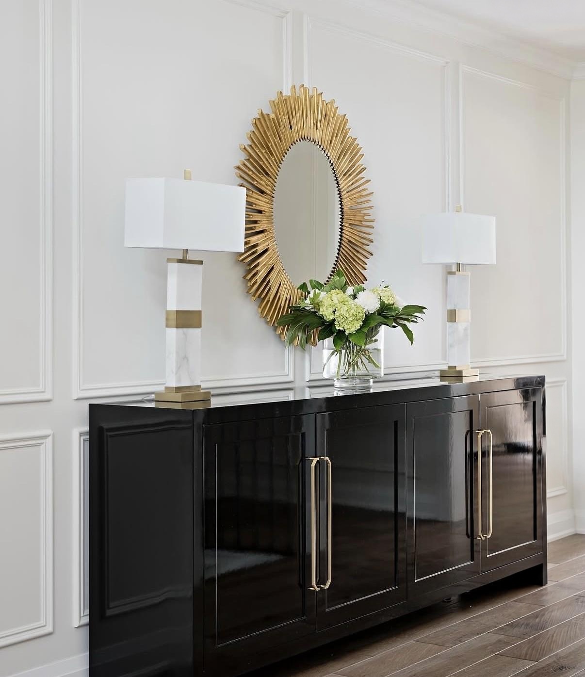 Small foyer with a generously scaled mirror and console
