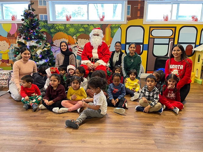 Santa with all the kids and teachers at HIDE ‘n' SEEK DAYCARE - Licensed Childcare Center in Brampton, Ontario