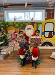 Santa giving kids gifts for christmas at HIDE ‘n' SEEK DAYCARE - Day Care Center in Brampton