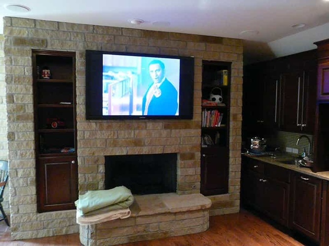 Large Size TV Installed on the wall of a living room by BTZ Audio Video, LLC.