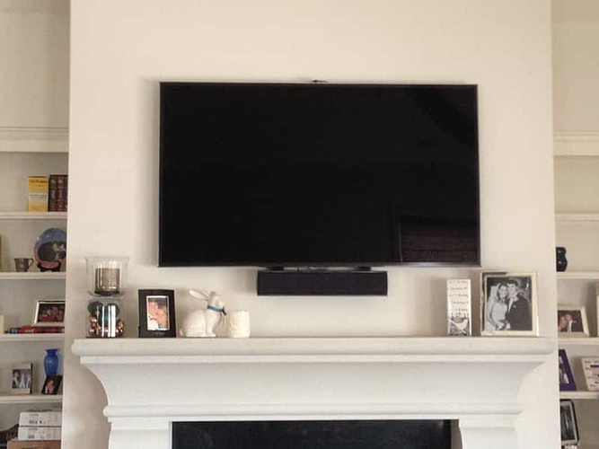 Large Size TV Mounted on Wall by professional of BTZ Audio Video, LLC.