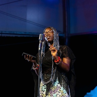 Darkstrand Visuals' photo of a woman singing profoundly and passionately during a singing competition event