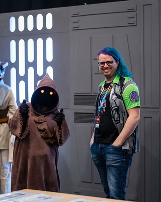 Darkstrand Visuals' photo of a person posing with a Star Wars character at an event