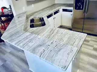 Enhance your living area with Olympus Granite timeless opulence and classic allure of a Marble Countertop