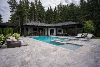 Green Crew Contracting Inc offer Flagstone Installation around pool area for elegant look