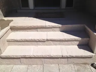 Flagstone Stair case build by Green Crew Contracting Inc creating exquisite view