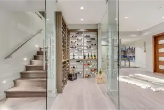 Explore the modern wine cellars at Leyland Drive, a custom home in West Vancouver by Noura Homes