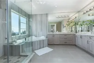 Indulge in the luxurious bathroom interior of Aura Phase 1, a custom home by Noura Homes