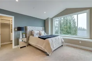 Discover the cozy bedroom interior within Highland custom homes, expertly crafted by Noura Homes