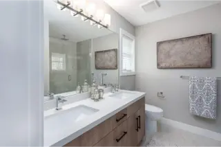 Explore the contemporary washroom interior within Towns At Trafalgar, a townhome collection by Noura Homes