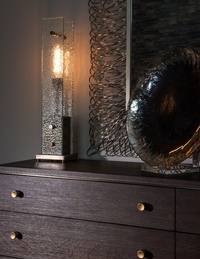 Lamp and Gramophone on Brown Wooden Dresser by R Designs, LLC