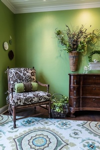 White and brown Floral padded Armchair beside Wooden Dresser - Interior Design Loch Lloyd by R Designs, LLC