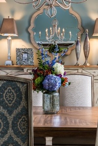 Flower bouquet in a Vase placed on Dining Table - Hunter’s Ridge Dining Room Remodel by R Designs, LLC