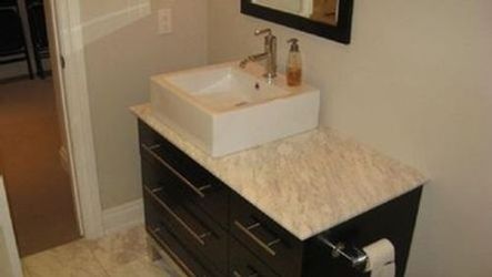 Modern bathroom vanity with vessel sink showcasing bathroom installation and renovation in Etobicoke, Toronto and Mississauga