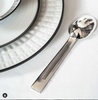 Stainless Steel Spoon Beside White Ceramic Plate - Art Deco Silverware at The Silver Peacock Inc