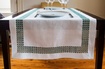 Luxury Table Linens with decorative border at The Silver Peacock Inc