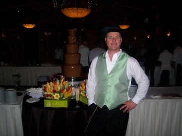Waiter Standing near Table with food
