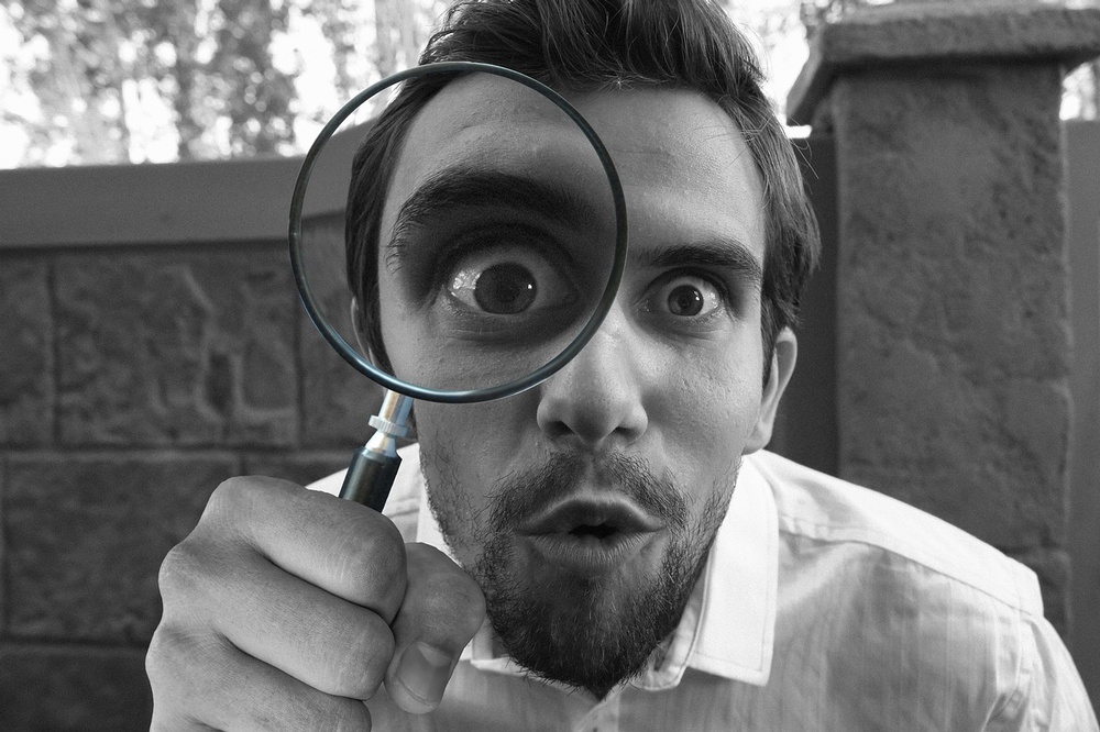 A man with a magnifying glass