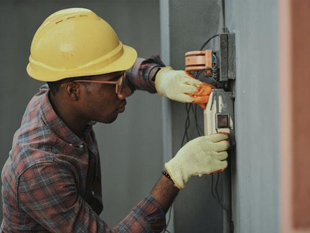 A man working on a wall.