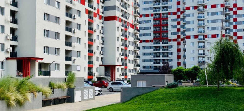 A white and red apartment complex