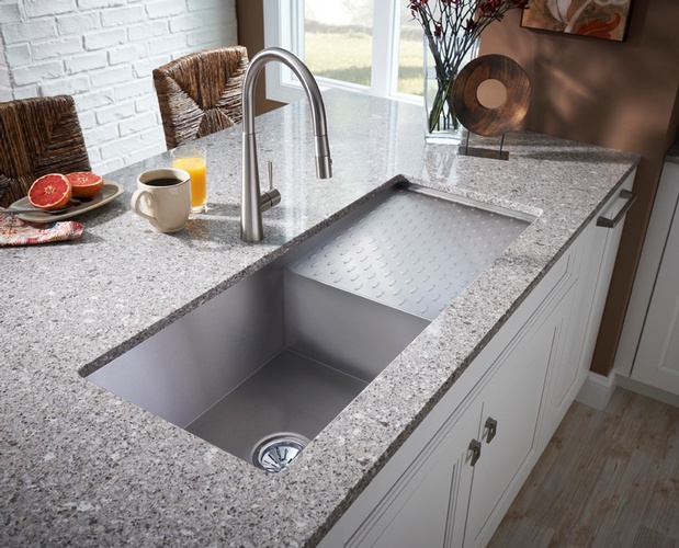 Kitchen sink with cover on Granite Countertop designed by Old Castle Home Design Center